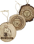 Three wooden ornaments with Bowdoin mascot, center ice medallion, and Bowdoin seal.