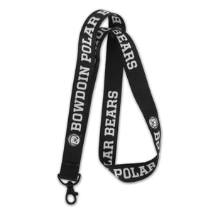 Black lanyard with repeating imprint of mascot medallion and BOWDOIN POLAR BEARS. Lobster claw clasp.