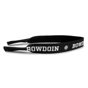 Black neoprene sunglass strap with sublimated imprint of BOWDOIN and mascot medallion repeating.
