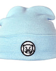Baby blue knit baby hat with embroidered mascot medallion patch on turned-up cuff.