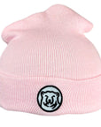 Baby pink knit baby hat with embroidered mascot medallion patch on turned-up cuff.