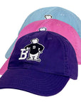 Three baseball caps in purple, pink, and blue with a cartoon bear logo on a white background