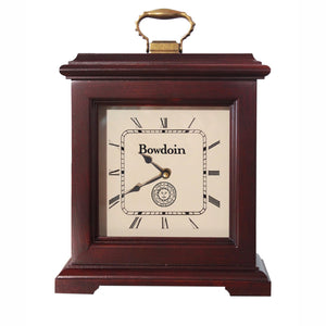 Burgundy finish clock with brass handle on top. Cream dial with Roman numerals, Bowdoin above hands, Bowdoin seal below hands.