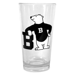 Pint glass with two-color black and white imprint of cartoon polar bear wearing a black sweater with a Bowdoin B on the chest, leaning on a large black Bowdoin B.