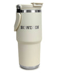 Cream-colored travel mug with 'Bowdoin' branding on a white background