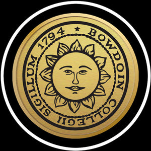 Closeup of gold sun seal medallion.