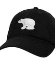 Black cap with a white polar bear logo on a white background