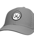 A gray baseball cap with a circular patch on the front featuring a stylized white polar bear head on a gray background.