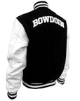 Back of varsity jacket showing arched white BOWDOIN applique on upper back.