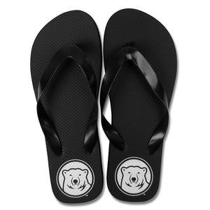 Black rubber flip flops with white mascot medallion imprint on heels.