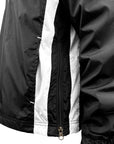 Closeup view of side zipper vent on lower left side of garment.