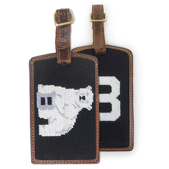 2 variants of needlepoint luggage tags.