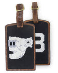 2 variants of needlepoint luggage tags.