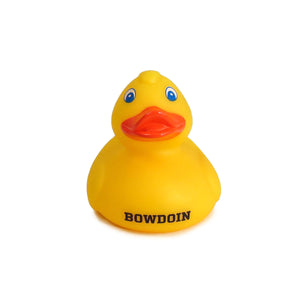 Classic yellow rubber duckie bath toy with black BOWDOIN imprint on chest.