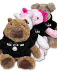 Four plush animal toys wearing black hoodies with white text, arranged together on a white background. The front toy is a brown capybara, the second toy is a white unicorn with pink accents, the third toy is a pink axolotl, and the rear toy is a tan dog.