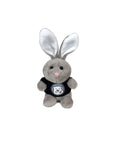 Small, stubby plush grey bunny in black T-shirt decorated with Bowdoin mascot medallion.