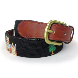 Curled up Bowdoin Life belt showing brown leather ends with brass buckle.