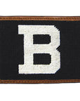 Leather card wallet with needlepoint decoration of white B on black field.