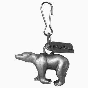 Left profile view of pewter zipper pull in the shape of a polar bear, with engraved tag reading POLAR BEARS on one side