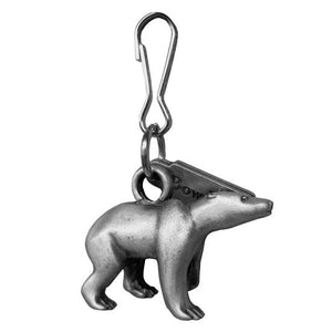 Right profile view of pewter zipper pull in the shape of a polar bear, with engraved tag reading Bowdoin  on one side.