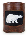 Leather can cooler with needlepoint inset of white polar bear in black ground.