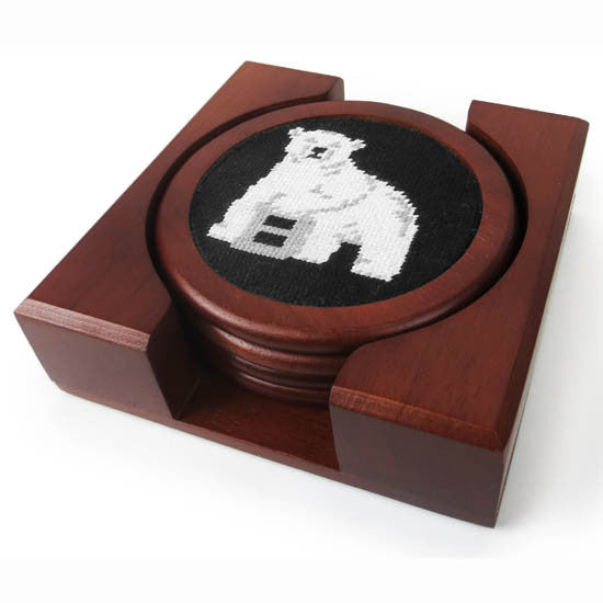Four wooden coasters with polar bear mascot needlepoint in wooden polished holder