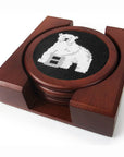 Four wooden coasters with polar bear mascot needlepoint in wooden polished holder