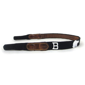 Needlepoint glasses strap with brown leather backing, repeating B and polar bear design.
