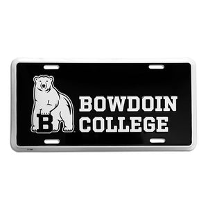 Black license plate with white border and imprint of polar bear mascot to the left of stacked BOWDOIN COLLEGE