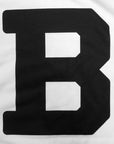 White quilt panel with large black B.