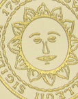 Detail of gold embossed seal on card