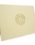 Embossed natural color notecard with gold embossed seal.