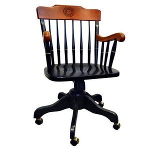 Black wood swivel office chair on brass casters, with maple back and arms. Back is engraved with Bowdoin College seal.