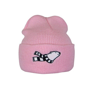 Pink toddler knit cuff beanie with embroidered smiling polar bear wearing a striped scarf on the cuff of the hat.