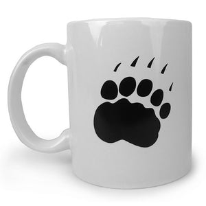 Back view of white mug with black imprint of paw.