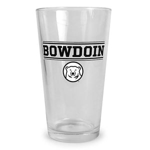 Clear pint glass with screen imprint of BOWDOIN in black with a white outline, sandwiched between pairs of thick and thin black bars with white outlines. Below is a two-color imprint of the polar bear medallion.