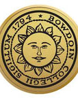 Gold engraved sun seal medallion.