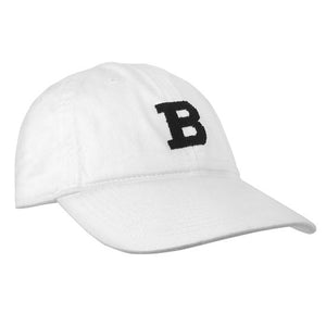White ball cap with needlepointed black B on front.