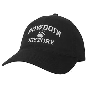 Black ball cap with white embroidery of BOWDOIN arched over a paw over HISTORY