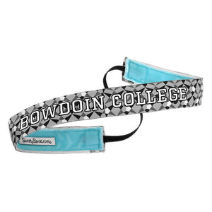 Sport headband with blue lining and black elastic back. Grey, black, and white geometric print, white BOWDOIN COLLEGE imprint with black stroke.