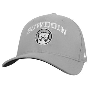 Light pewter grey baseball hat with white BOWDOIN embroidery arched over embroidered mascot medallion.