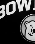 Closeup of white Bowdoin applique and embroidered mascot medallion.