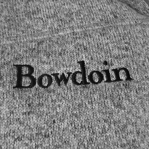 Closeup of Bowdoin embroidery on heathered fleece jacket.