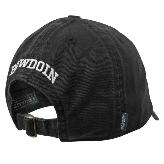 View of black baseball hat from the back, showing arched white BOWDOIN embroidery and brass adjustable closure buckle.