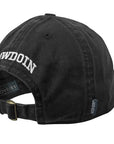 View of black baseball hat from the back, showing arched white BOWDOIN embroidery and brass adjustable closure buckle.