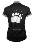 Back view of women's cycling jersey, with white paw print on back.