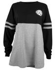 Women's long sleeved shirt with black top half and sleeves, and grey bottom. Grey stripes on sleeves, and mascot medallion on left chest.