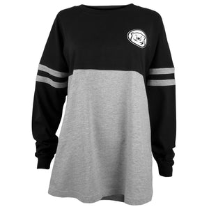 Women's long sleeved shirt with black top half and sleeves, and grey bottom. Grey stripes on sleeves, and mascot medallion on left chest.