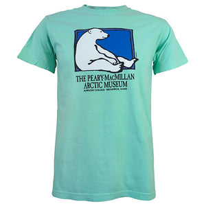 Light aqua green short-sleeved T-shirt with picture of a polar bear sitting against the side of a rectangle with a blue background. Text beneath reads THE PEARY-MACMILLAN ARCTIC MUSEUM, BOWDOIN COLLEGE, BRUNSWICK, MAINE