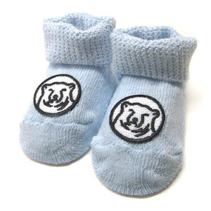 Blue baby socks with embroidered mascot medallion patch on top of foot.